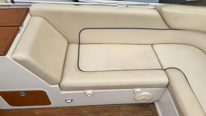 Slide: The Image of Interior of a 2006 Chris-Craft Launch 28 with beige upholstery. - 15