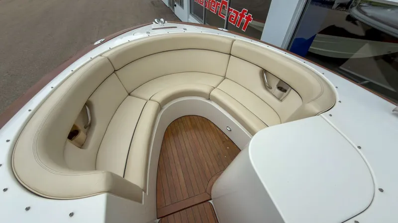 Slide: The Image of Interior of a 2006 Chris-Craft Launch 28 with beige seating. - 16
