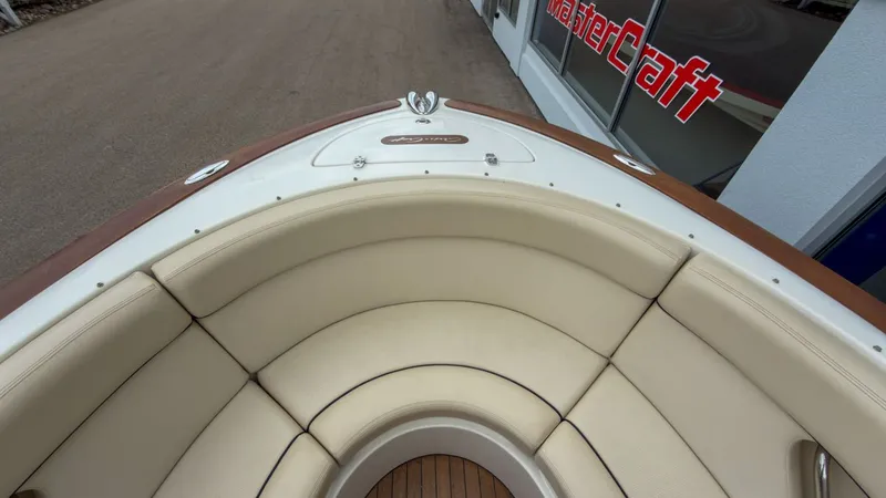 Slide: The Image of Interior view of a 2006 Chris-Craft Launch 28 boat with beige seating. - 17