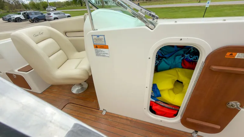 Slide: The Image of 2006 Chris-Craft Launch 28 boat interior with seat and storage compartment. - 20