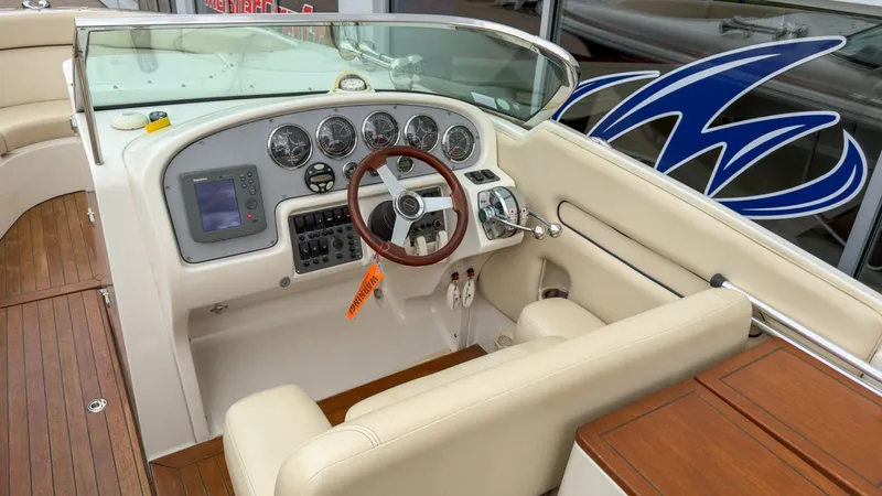 Slide: The Image of Interior view of a 2006 Chris-Craft Launch 28 boat cockpit. - 21