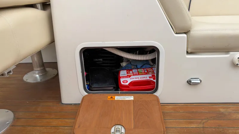 Slide: The Image of 2006 Chris-Craft Launch 28 storage compartment with first aid kit. - 26