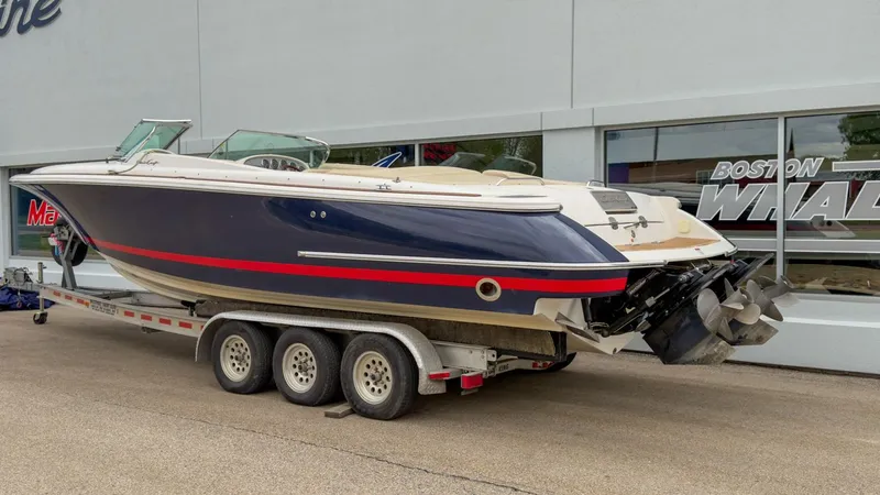Slide: The Image of 2006 Chris-Craft Launch 28 boat on trailer outside a building. - 3