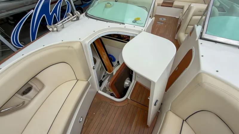 Slide: The Image of Interior of a 2006 Chris-Craft Launch 28 boat with wooden flooring. - 30