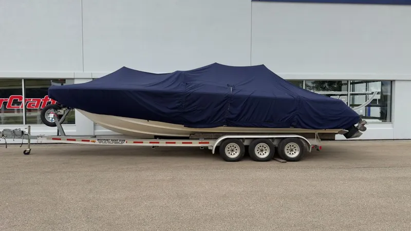 Slide: The Image of 2006 Chris-Craft Launch 28 boat covered on trailer. - 31
