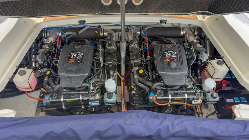 Slide: The Image of Engine compartment of a 2006 Chris-Craft Launch 28 with twin Mercury engines. - 7