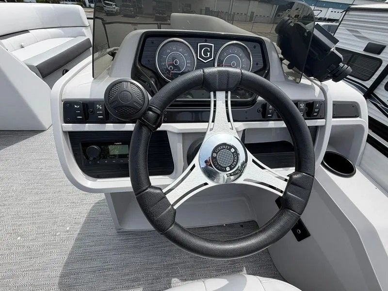 Slide: The Image of 2024 Godfrey Pontoons 2286 SFL helm with steering wheel and gauges. - 11