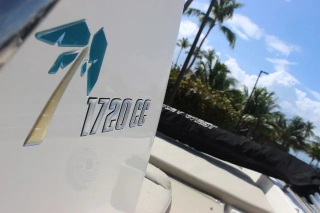 Slide: The Image of Key West 1720 Center Console boat, 2024 model, with palm trees in background. - 14