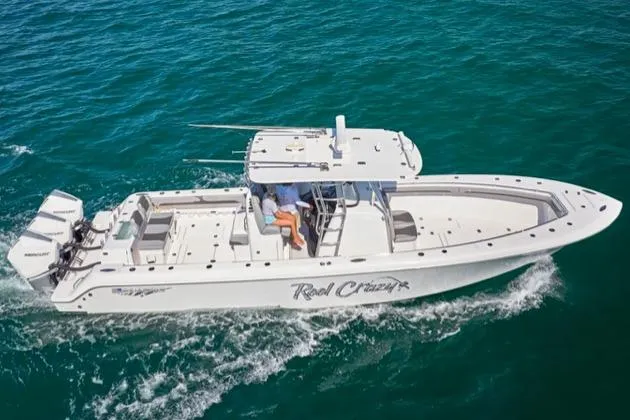 Slide: The Image of 2022 Bluewater 355e boat cruising on clear blue ocean waters. - 11