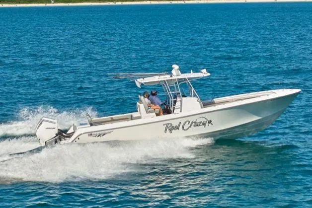 Slide: The Image of 2022 Bluewater 355e boat cruising on open water, side view. - 2