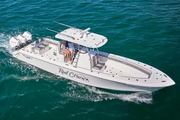 Slide: The Image of 2022 Bluewater 355e boat cruising on clear blue ocean waters. - 3