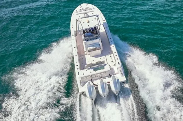 Slide: The Image of 2022 Bluewater 355e boat cruising on open water, aerial view. - 5