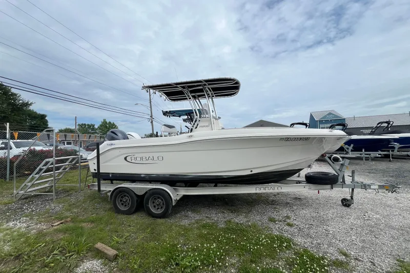 The Image of 2020 Robalo R200 Center Console boat on trailer, parked outdoors. - 0
