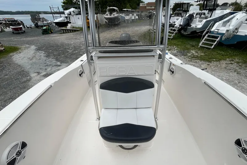 Slide: The Image of 2020 Robalo R200 Center Console boat interior with seating and console view. - 12
