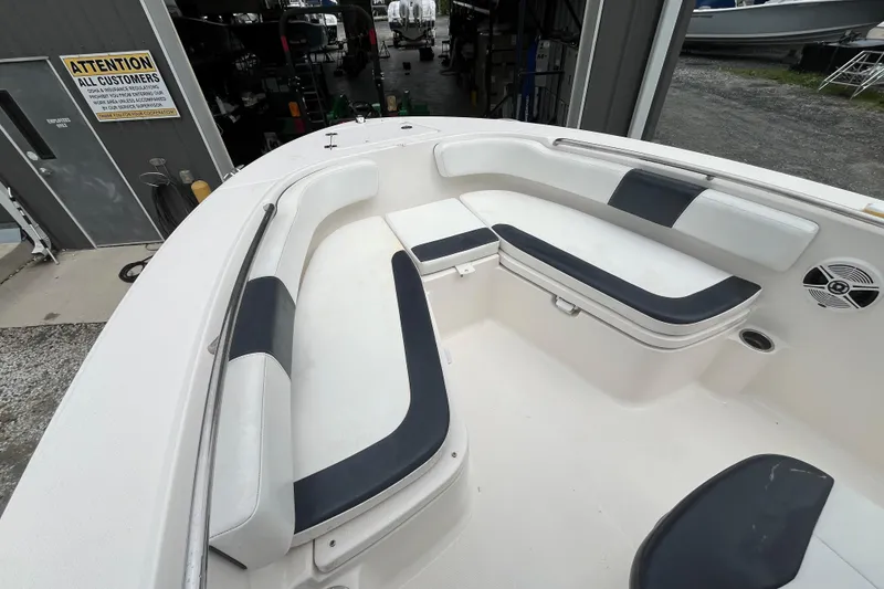 Slide: The Image of 2020 Robalo R200 Center Console boat interior with cushioned seating. - 15