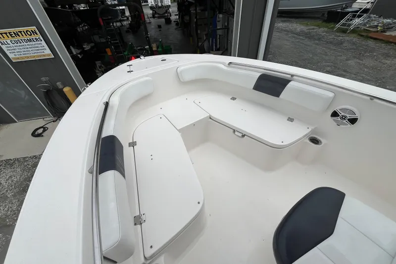 Slide: The Image of 2020 Robalo R200 Center Console boat interior with seating and storage compartments. - 16