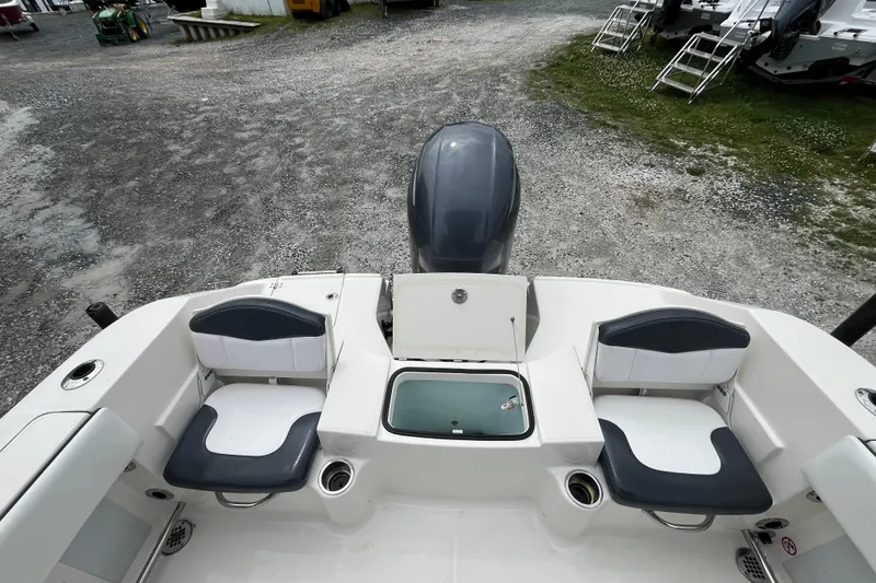 Slide: The Image of 2020 Robalo R200 Center Console boat interior with seating and storage compartments. - 5