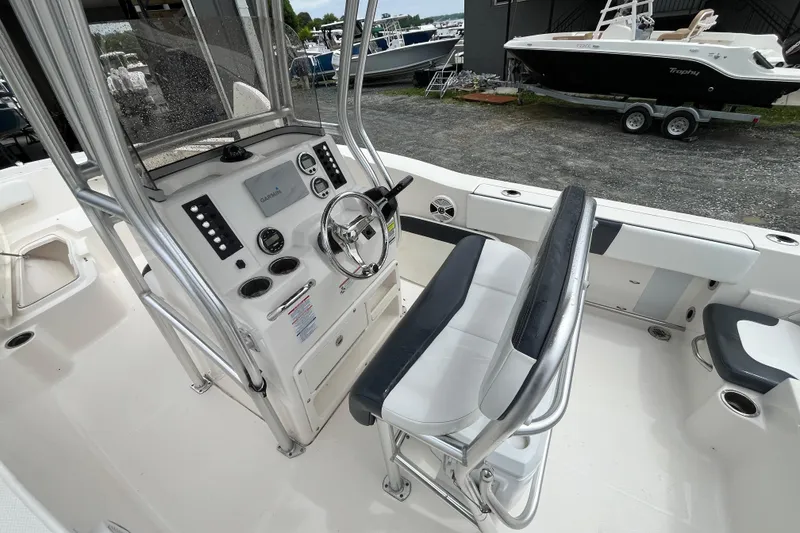 Slide: The Image of 2020 Robalo R200 Center Console boat interior with steering wheel and seating. - 7