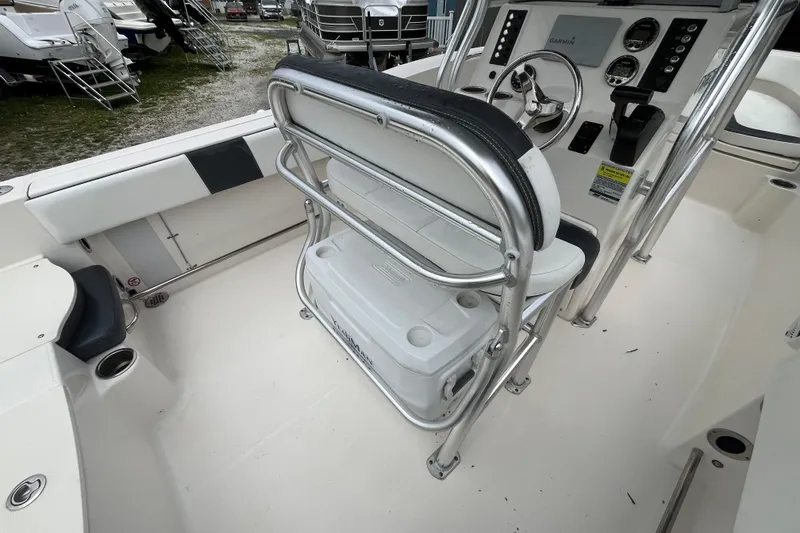 Slide: The Image of 2020 Robalo R200 Center Console boat interior with steering wheel and seating. - 9