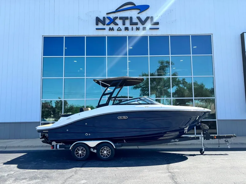 The Image of 2026 Sea Ray SPX 210 boat in showroom. - 1