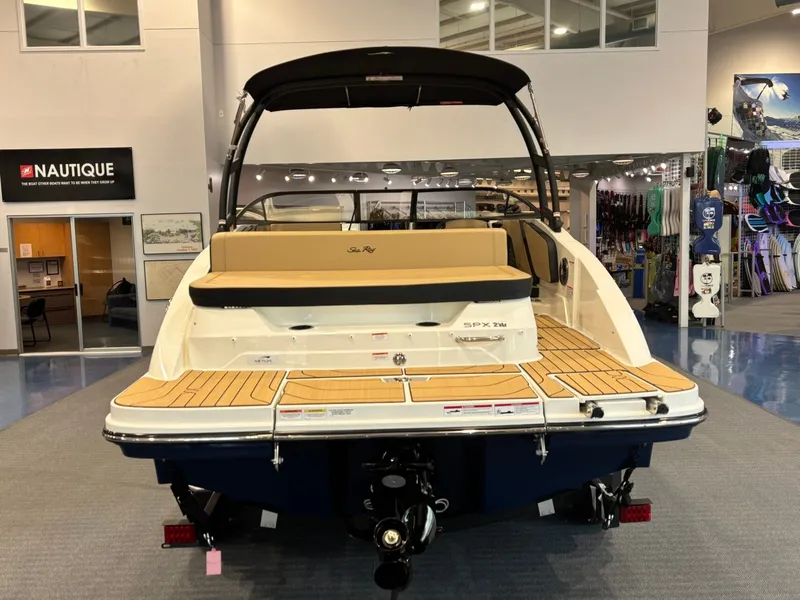 Slide: The Image of 2026 Sea Ray SPX 210 boat in showroom. - 10