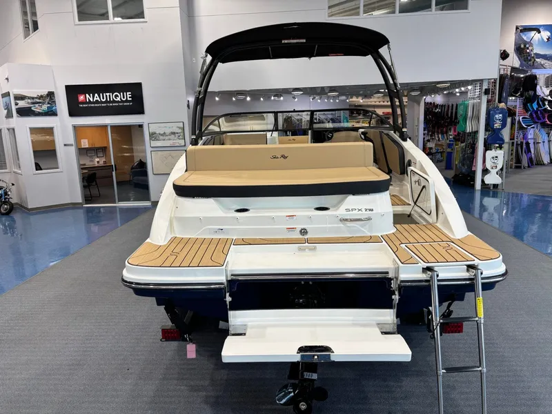 Slide: The Image of 2026 Sea Ray SPX 210 boat displayed in showroom. - 11