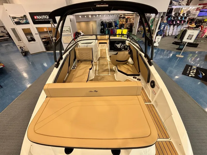 Slide: The Image of Interior view of Sea Ray SPX 210 boat, 2026 model, in a showroom. - 12