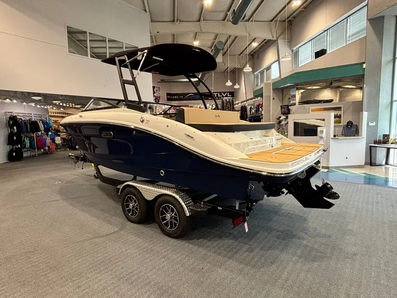 Slide: The Image of 2026 Sea Ray SPX 210 boat in showroom. - 6