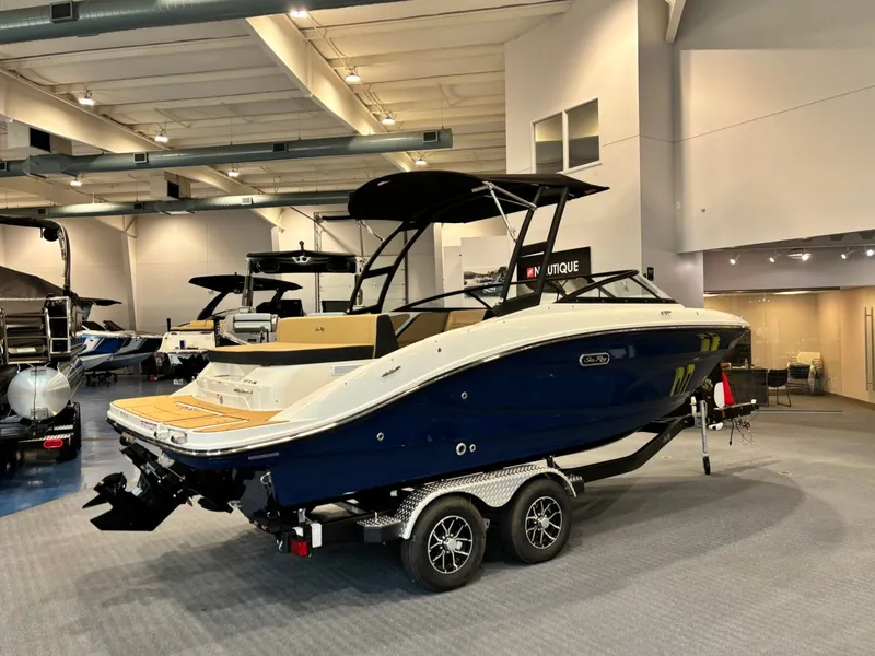 Slide: The Image of 2026 Sea Ray SPX 210 boat in showroom on trailer. - 7