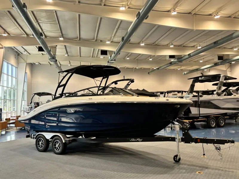 Slide: The Image of 2026 Sea Ray SPX 210 boat in a showroom. - 8