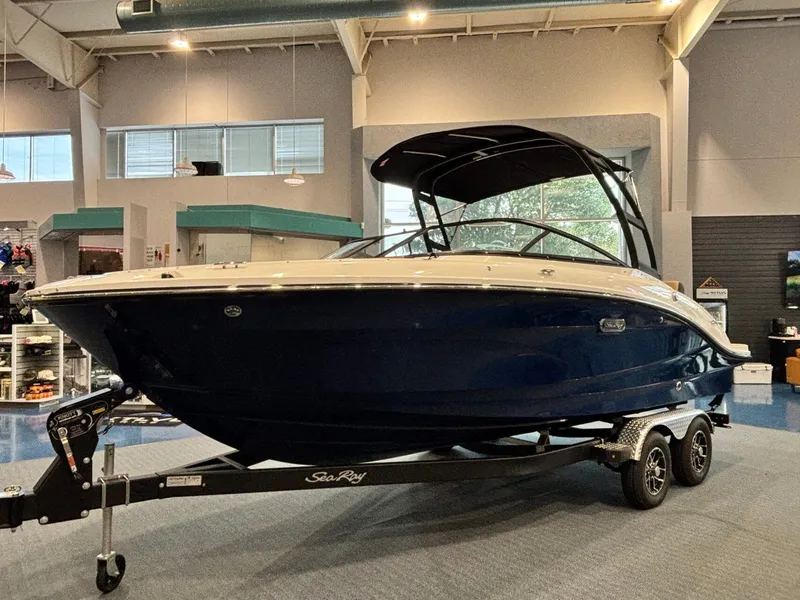 Slide: The Image of 2026 Sea Ray SPX 210 boat in showroom on trailer. - 9