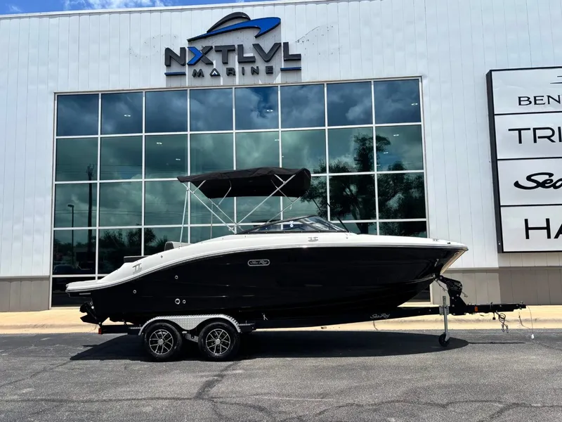 The Image of 2026 Sea Ray SPX 210 boat in front of NXT LVL Marine building. - 1