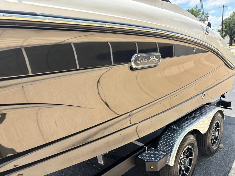 Slide: The Image of 2026 Sea Ray SPX 210 boat on trailer, glossy black finish. - 26