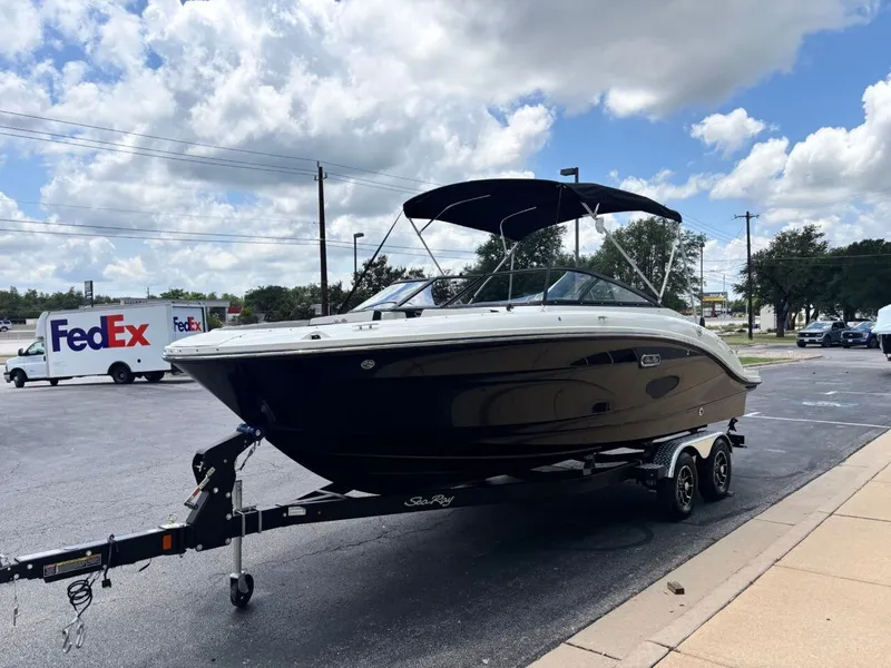 Slide: The Image of 2026 Sea Ray SPX 210 boat on trailer, parking lot, FedEx truck in background. - 3
