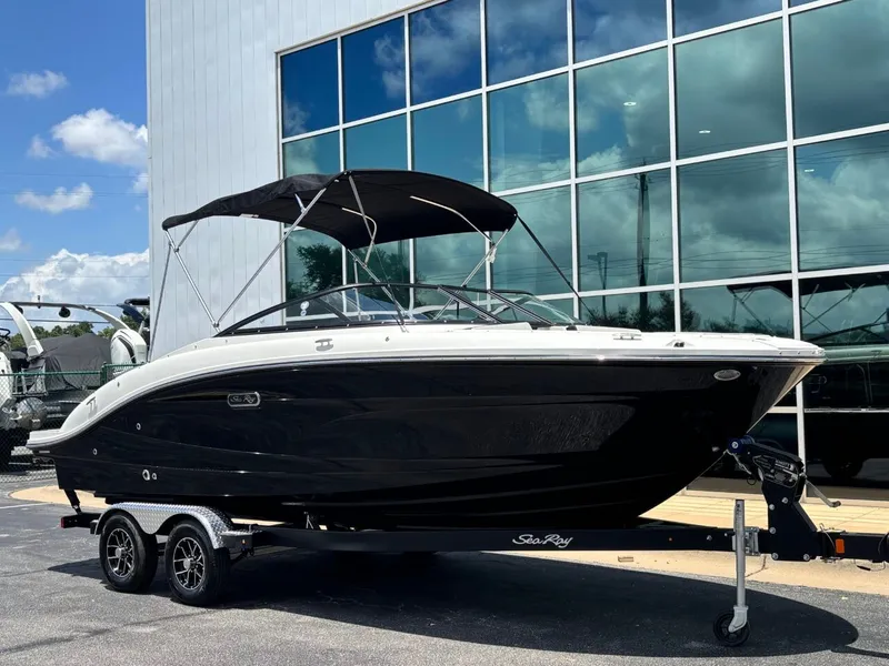 Slide: The Image of 2026 Sea Ray SPX 210 boat in front of glass building. - 5