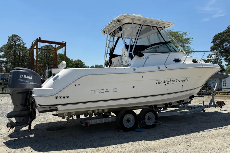 Slide: The Image of 2007 Robalo R305 Walkaround boat on trailer with Yamaha engine, named "The Mighty Terrapin." - 1