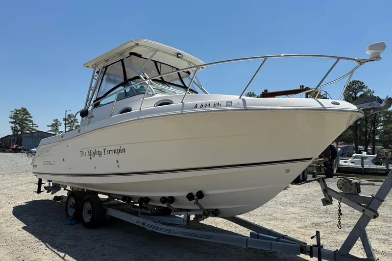 Slide: The Image of 2007 Robalo R305 Walkaround boat on trailer, named "The Mighty Terrapin." - 2