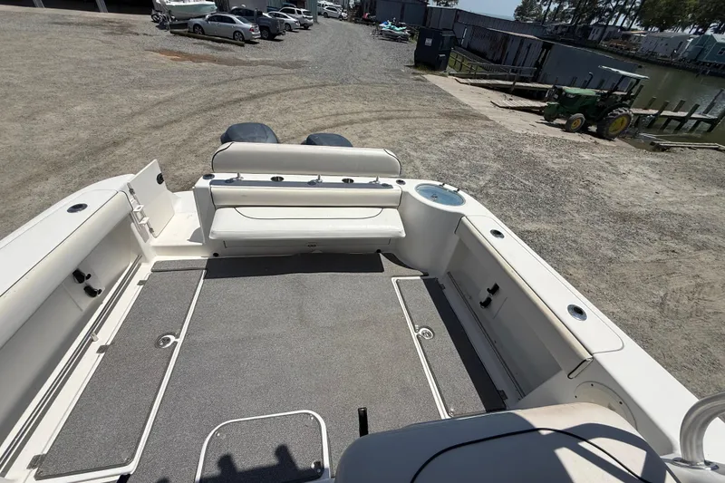 Slide: The Image of 2007 Robalo R305 Walkaround boat deck with seating and storage compartments. - 21