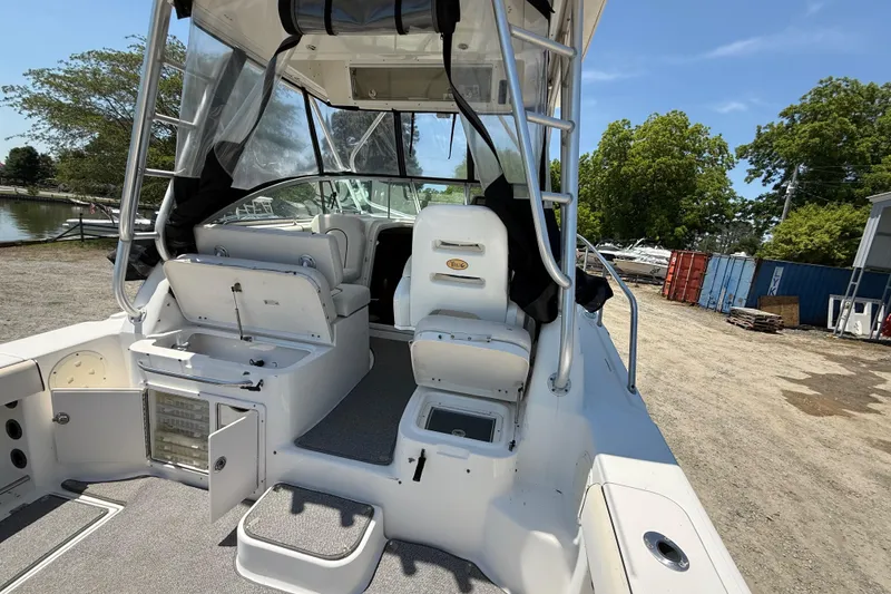 Slide: The Image of 2007 Robalo R305 Walkaround boat interior with seating and storage compartments. - 23