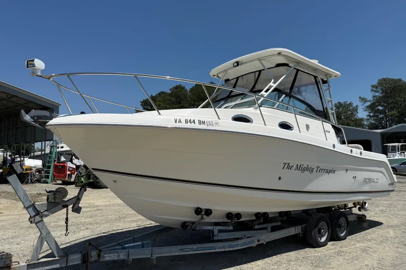 Slide: The Image of 2007 Robalo R305 Walkaround boat on trailer, named "The Mighty Terrapin." - 25