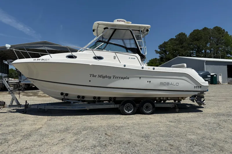 Slide: The Image of 2007 Robalo R305 Walkaround boat on trailer, named "The Mighty Terrapin." - 27