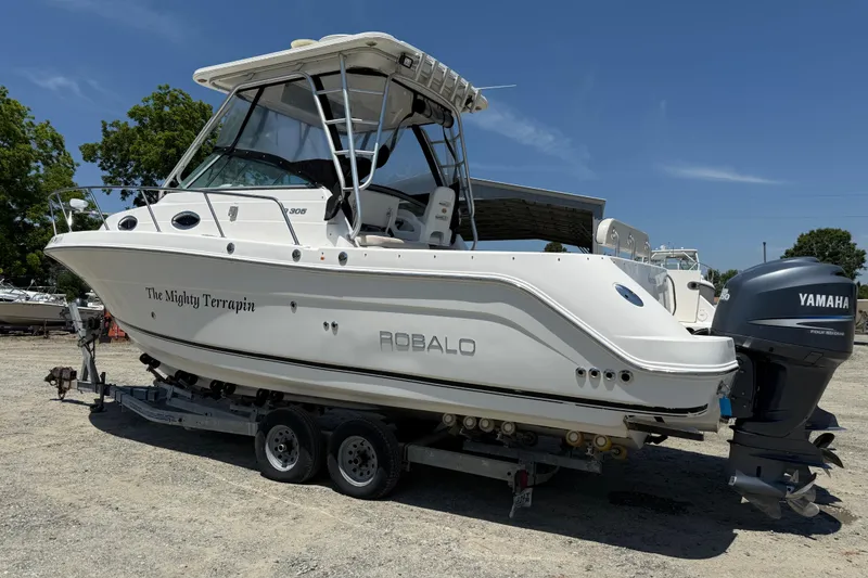 Slide: The Image of 2007 Robalo R305 Walkaround boat on trailer with Yamaha outboard motor. - 28