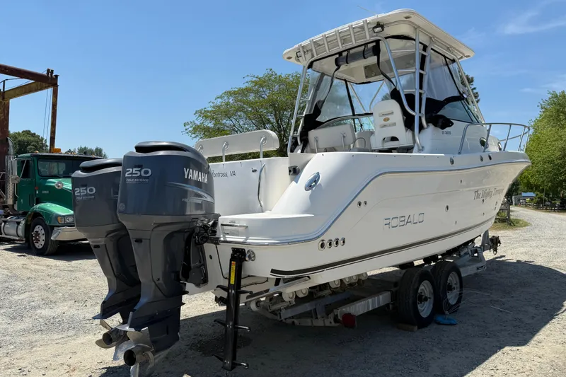 Slide: The Image of 2007 Robalo R305 Walkaround boat with twin Yamaha 250 engines on a trailer. - 3