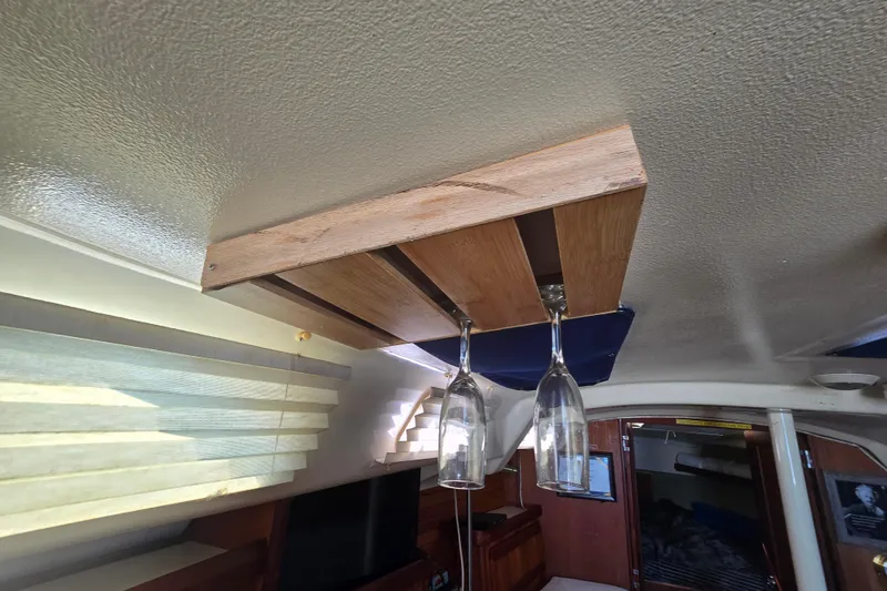 Slide: The Image of Interior of 1993 Hunter Legend 35.5 yacht with wooden wine glass holder. - 24