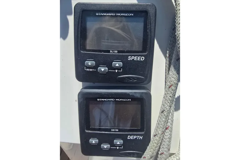 Slide: The Image of Standard Horizon speed and depth gauges on a 1993 Hunter Legend 35.5 sailboat. - 34
