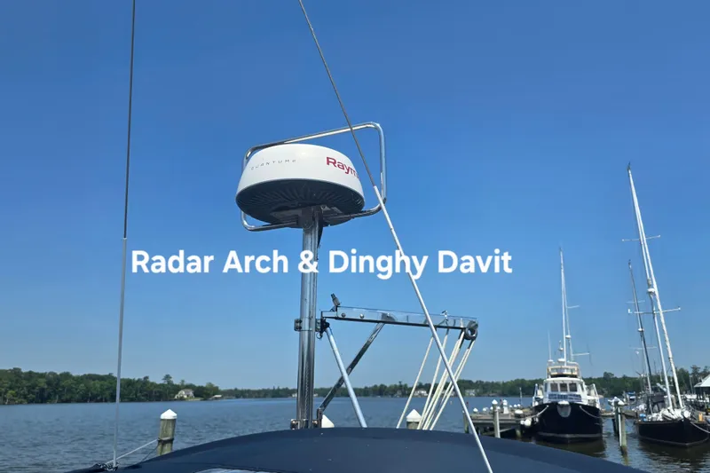 Slide: The Image of Radar arch and dinghy davit on 1993 Hunter Legend 35.5 sailboat under clear blue sky. - 8