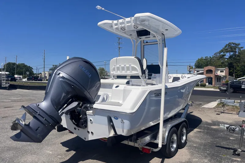 Slide: The Image of 2026 Tidewater 220 CC Adventure boat with Yamaha outboard motor on trailer. - 4
