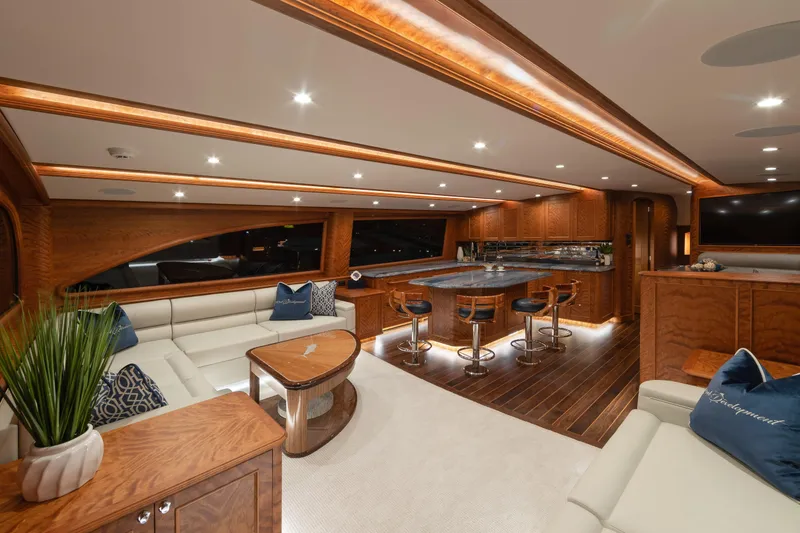 Slide: The Image of Luxurious interior of 2020 Jarrett Bay 84 yacht with elegant wood finishes and modern seating. - 55