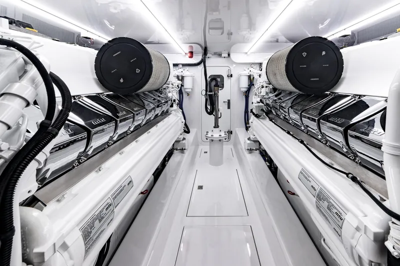 Slide: The Image of Engine room of 2020 Jarrett Bay 84 yacht, featuring advanced machinery and sleek design. - 92