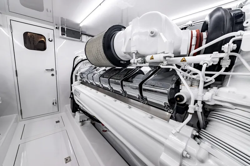 Slide: The Image of Engine room of 2020 Jarrett Bay 84 yacht, showcasing a powerful, pristine engine setup. - 93
